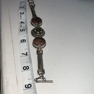 6.5”-8.5” antique brass finish bracelet with 3 snaps, toggle close.  NWOT